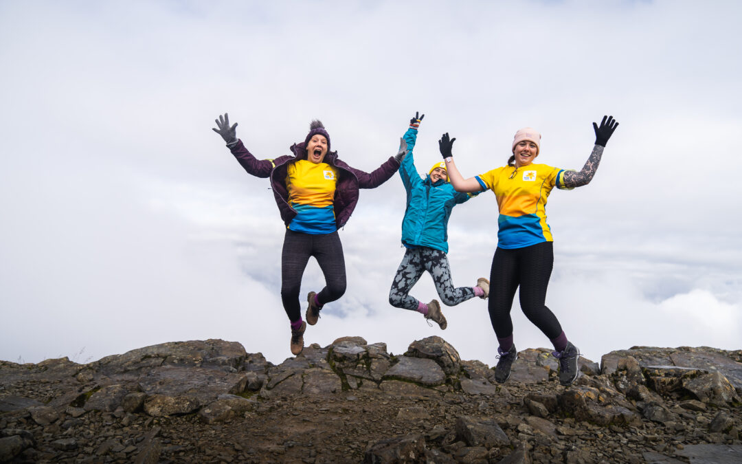 Ben Nevis walkers jumping for joy on summit